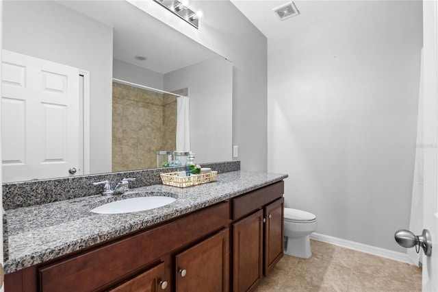 bathroom with vanity, toilet, and a shower with shower curtain