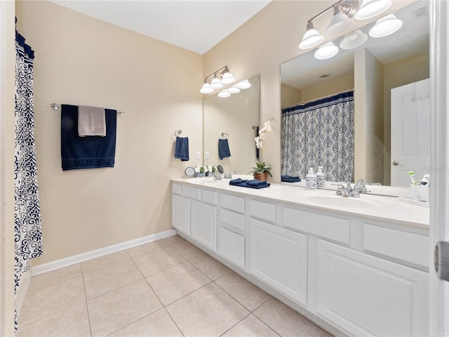 bathroom featuring tile patterned flooring and vanity