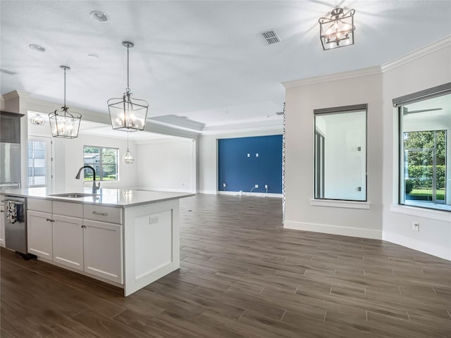 kitchen with sink, decorative light fixtures, dishwasher, an island with sink, and white cabinets