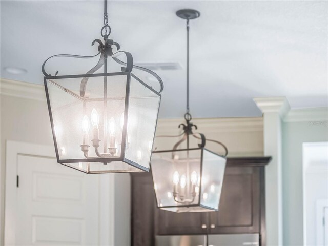 interior details with crown molding and a notable chandelier