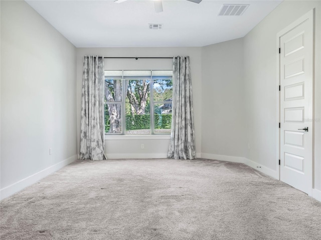 carpeted empty room with ceiling fan