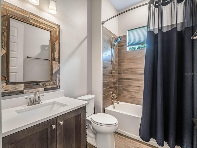 full bathroom with vanity, wood-type flooring, shower / bath combo, and toilet