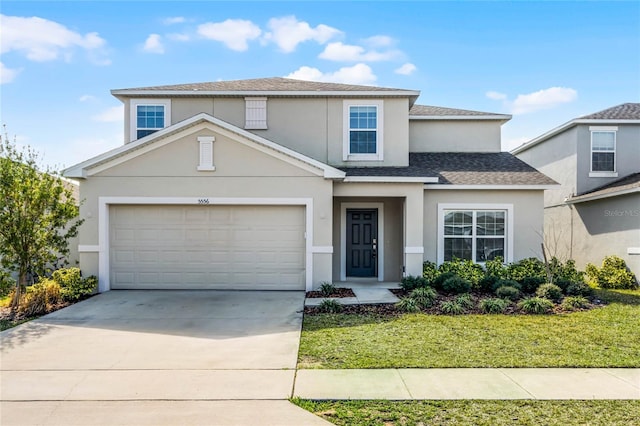 front of property featuring a garage and a front yard