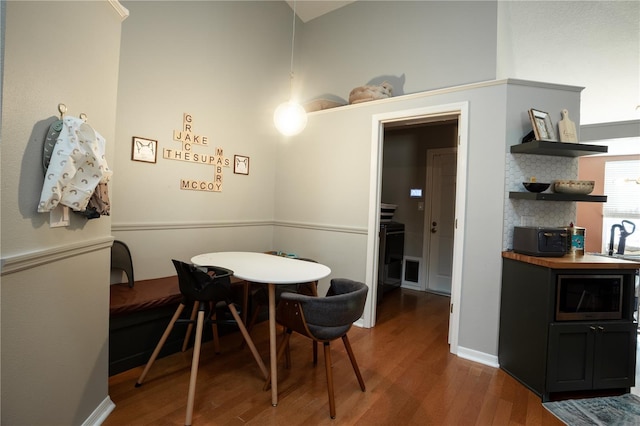 dining room with hardwood / wood-style flooring and sink