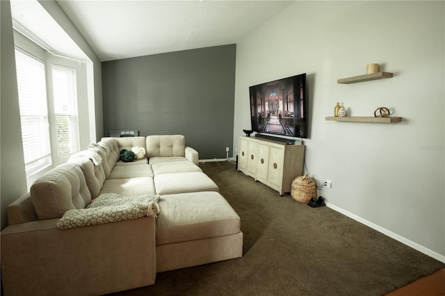 living room featuring lofted ceiling and dark colored carpet