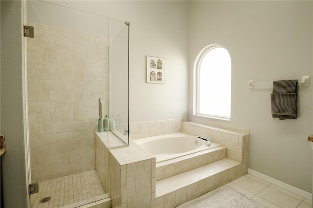 bathroom with plus walk in shower and tile patterned flooring