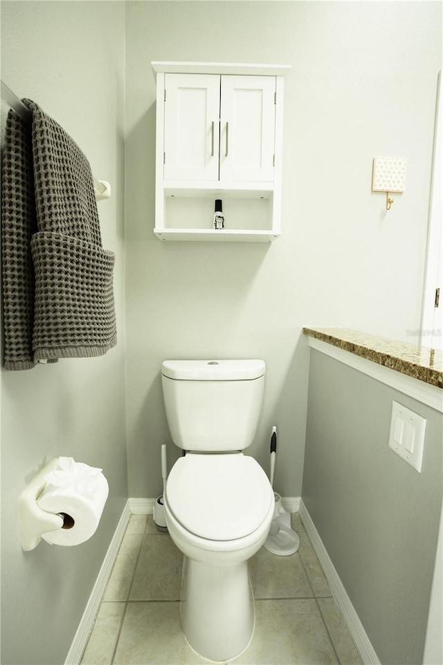 bathroom with tile patterned floors and toilet