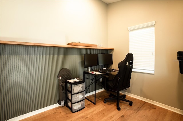 office space with wood-type flooring