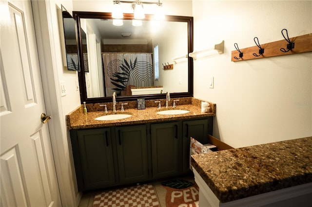 bathroom featuring a shower with curtain and vanity