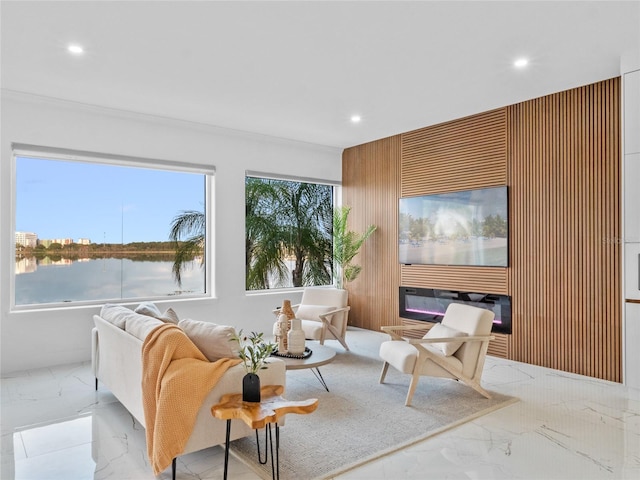 living room with a healthy amount of sunlight and a water view