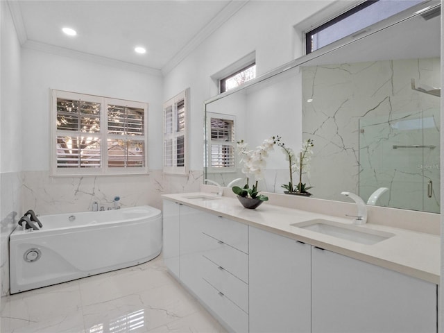 bathroom featuring vanity, crown molding, a wealth of natural light, and tile walls