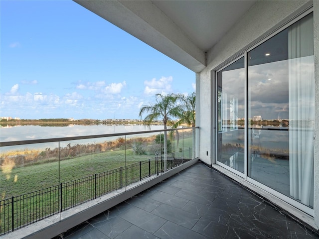 balcony featuring a water view