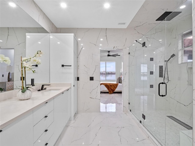 bathroom with vanity and a shower with door