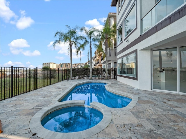 view of pool featuring an in ground hot tub and a patio