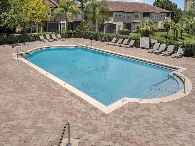 view of swimming pool featuring a patio area