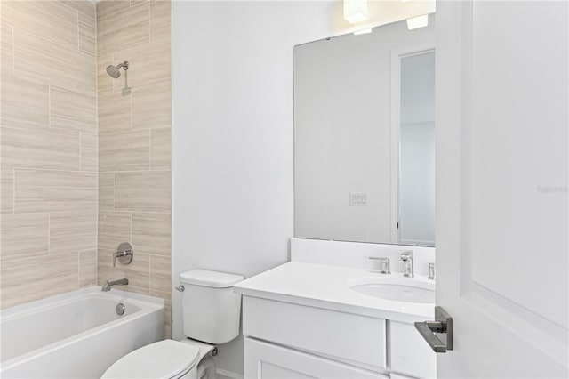 full bathroom featuring vanity, tiled shower / bath, and toilet