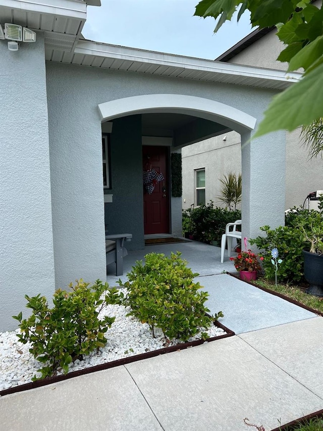 property entrance with a patio