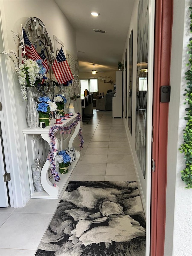 hallway with tile patterned floors