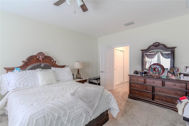 bedroom with light carpet and ceiling fan