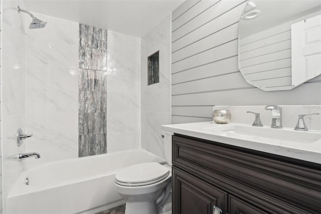 full bathroom with vanity, toilet, and tiled shower / bath