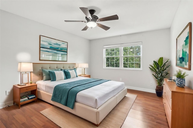 bedroom with light wood-type flooring and ceiling fan