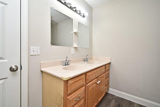 bathroom featuring vanity and hardwood / wood-style floors