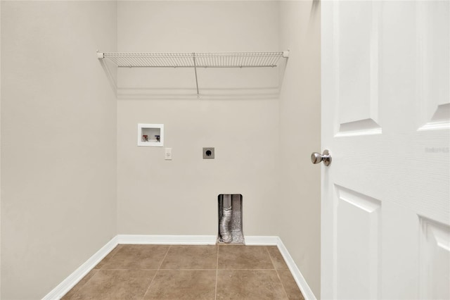 washroom with electric dryer hookup, hookup for a washing machine, and light tile patterned flooring