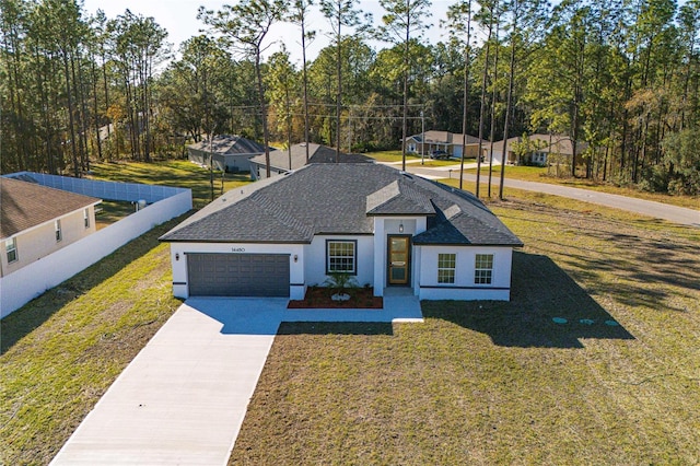 view of front facade featuring a garage and a front yard