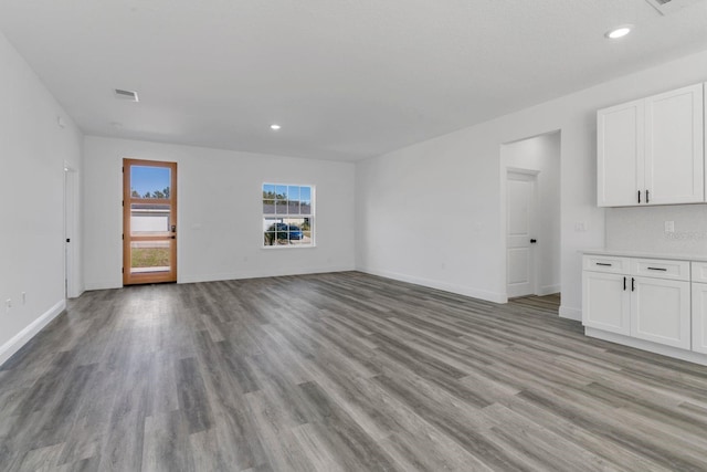 unfurnished living room with light hardwood / wood-style flooring