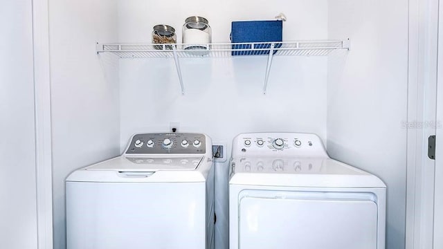 laundry area with independent washer and dryer