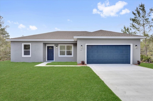 view of front of home with a garage and a front yard