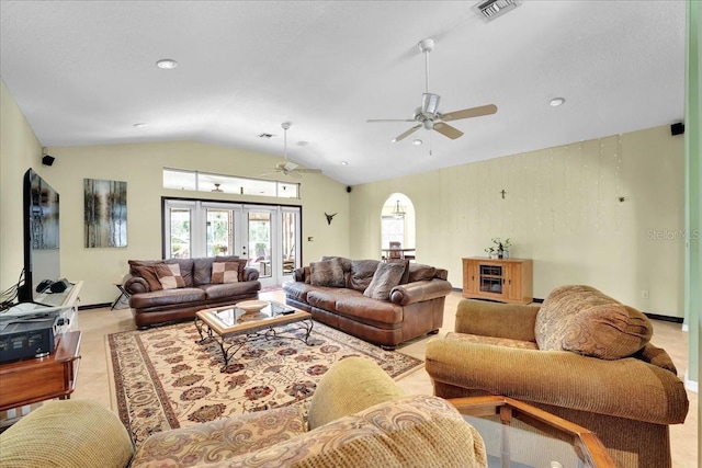 living room with french doors, ceiling fan, and lofted ceiling