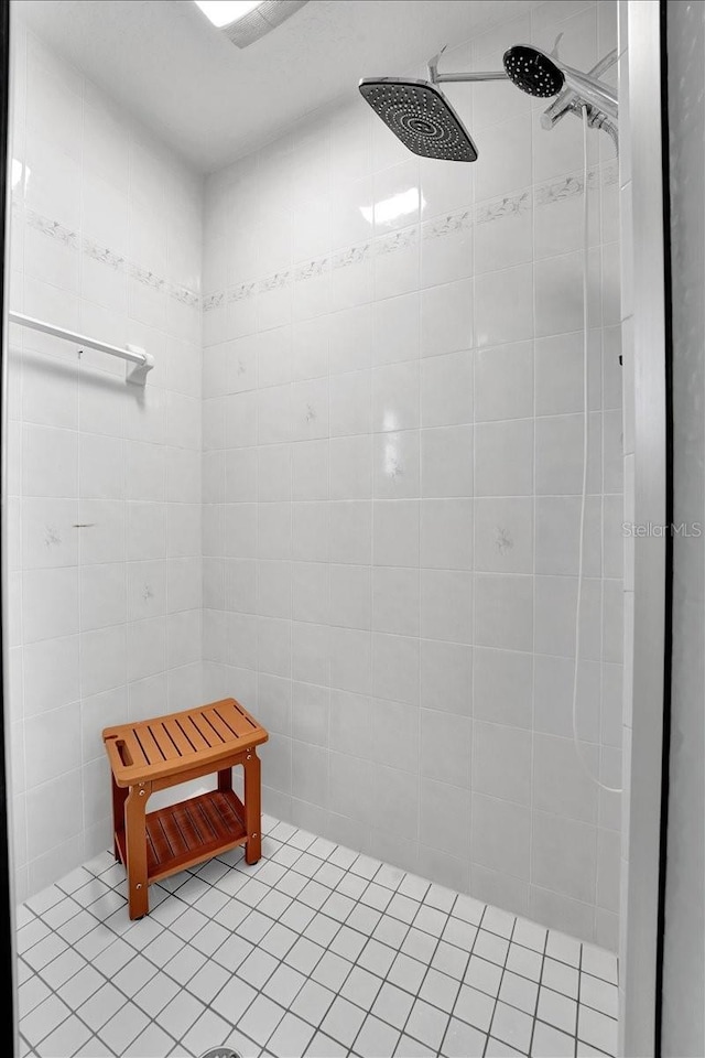 bathroom with a tile shower