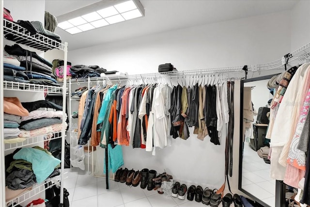 spacious closet with tile patterned floors