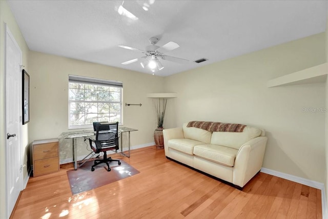 home office featuring ceiling fan and light wood-type flooring