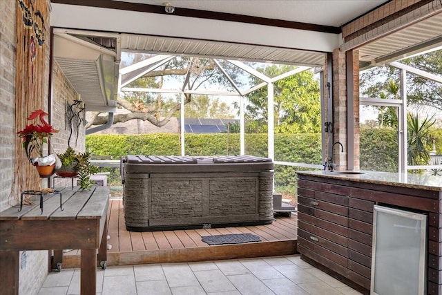 unfurnished sunroom with sink