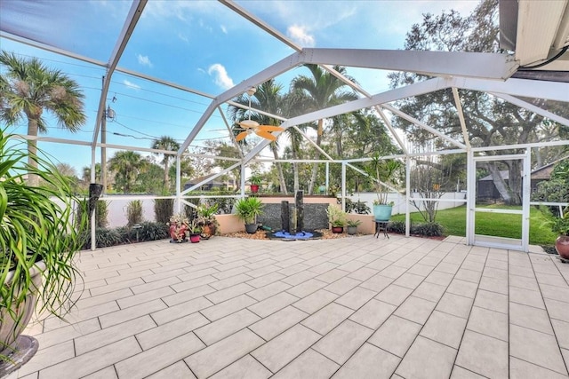 view of patio / terrace featuring a lanai