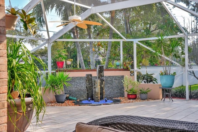 view of patio with a lanai and ceiling fan