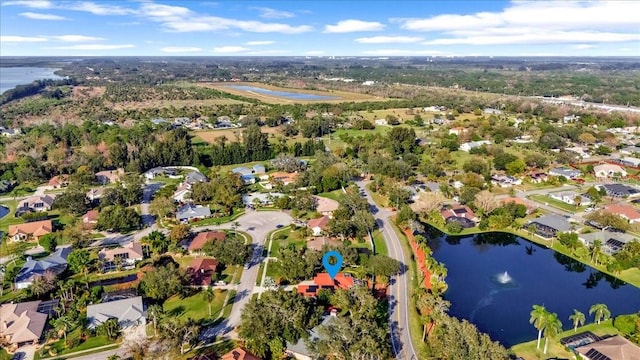 drone / aerial view with a water view