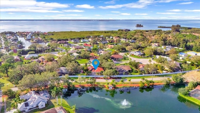 drone / aerial view with a water view