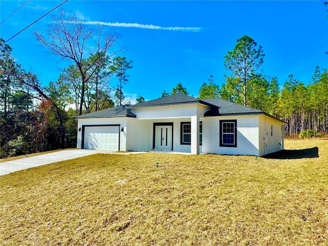 view of front of property with a garage and a front yard