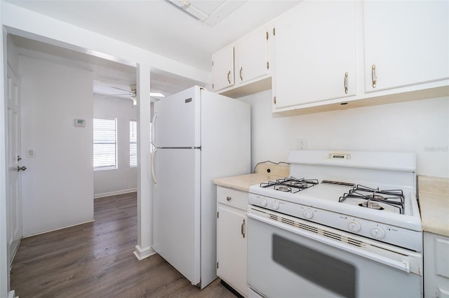 kitchen with ceiling fan, dark hardwood / wood-style flooring, white cabinets, and white appliances