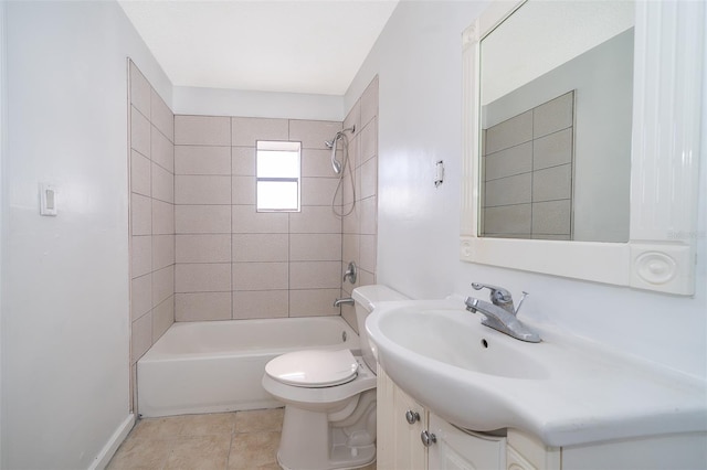 full bathroom featuring tiled shower / bath combo, vanity, tile patterned flooring, and toilet