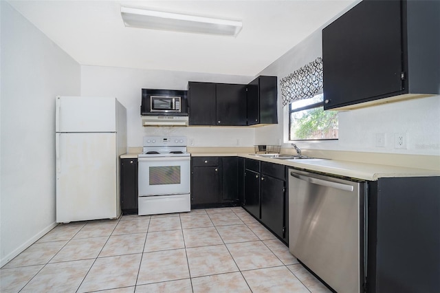 kitchen with sink, white appliances, and light tile patterned floors