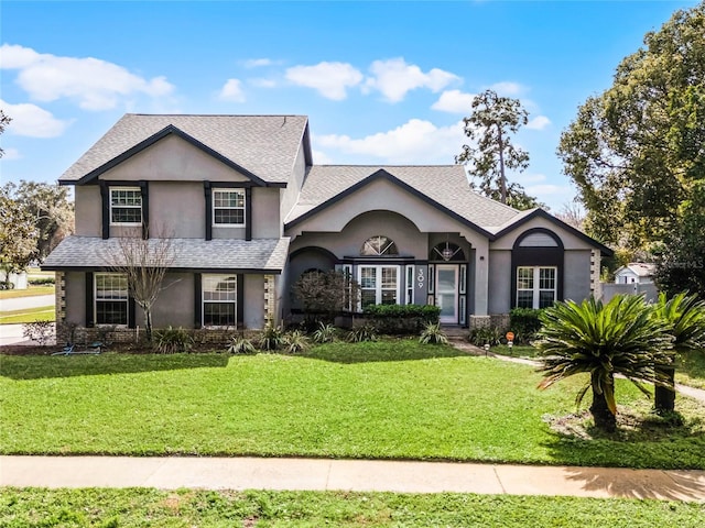 view of property with a front lawn