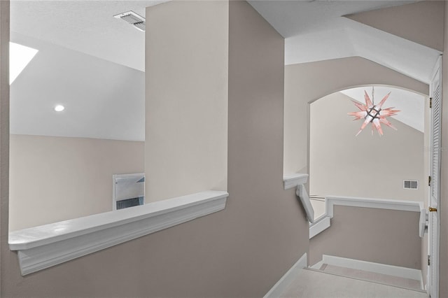 bathroom featuring lofted ceiling