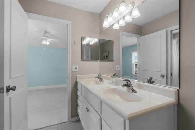 bathroom with tile patterned flooring, vanity, and ceiling fan