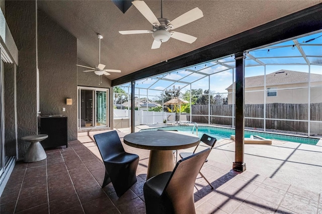 exterior space with a pool and vaulted ceiling