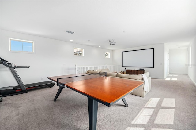 game room with light colored carpet