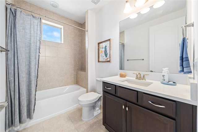 full bathroom featuring vanity, toilet, tile patterned flooring, and shower / tub combo